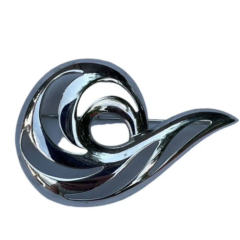 Vintage shiny Monet swirl brooch. Large
